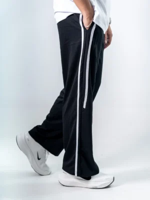 photography of Black Dual Stripe Sweatpants isolated on a clean background.