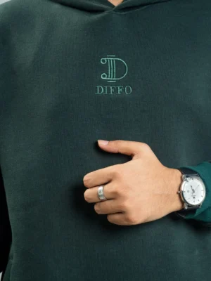 photography of 𝐂𝐨𝐧𝐭𝐫𝐚𝐬𝐭 𝐎𝐥𝐢𝐯𝐞 | Hoodie isolated on a clean background.