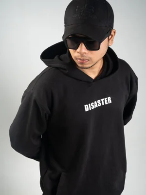 photography of 𝐁𝐋𝐀𝐂𝐊 𝐃𝐈𝐒𝐀𝐒𝐓𝐄𝐑 | Hoodie isolated on a clean background.