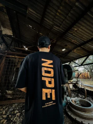 photography of NOPE | Drop Shoulder isolated on a clean background.